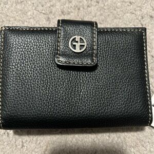 Black pebble leather tri-fold Giani Berni wallet.